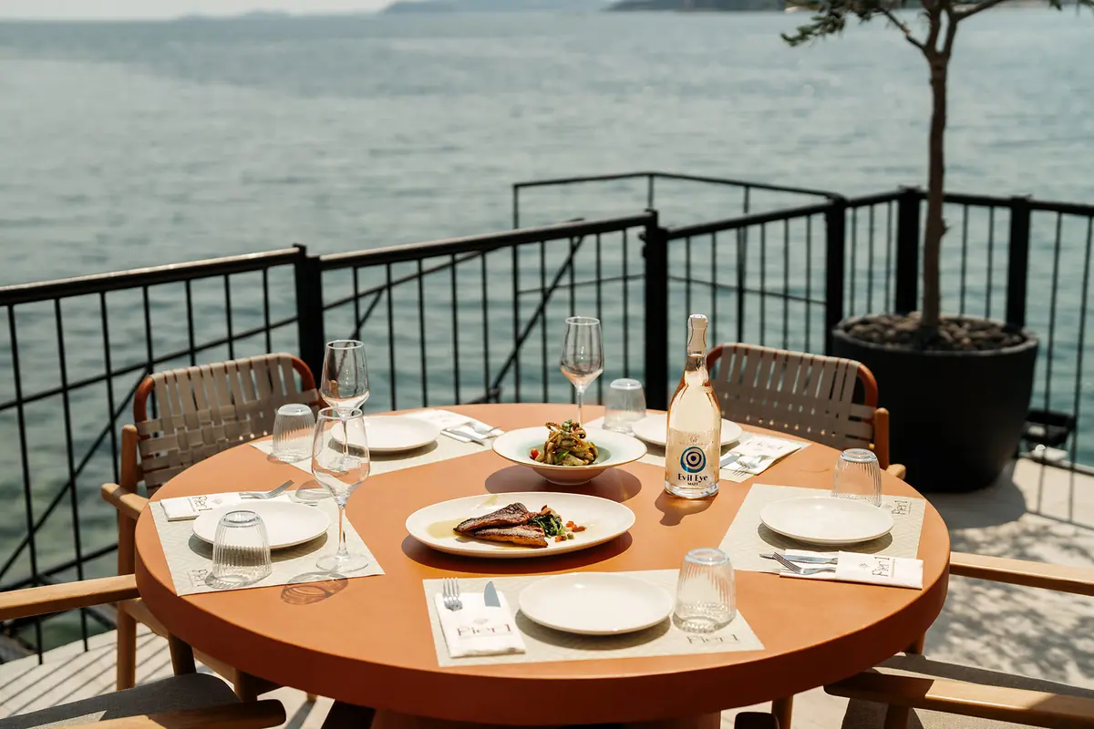 Tables set by the water